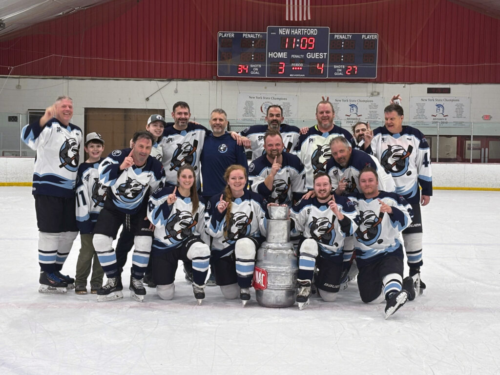 A photo of the Great White hockey team after winning the 2025–2026 Adult C League Championship