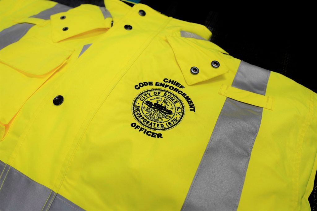 a photo of a high visibility jacket with the words Chief Code Enforcement Officer on the top right chest